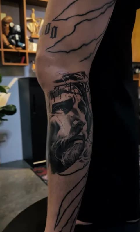 Tattoo artist preparing stencil for a client